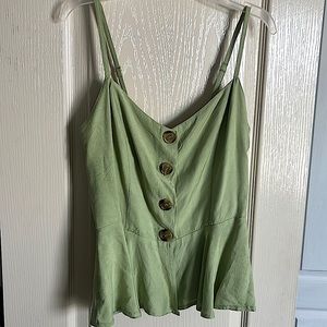 Light green top that completely buttons down the front.